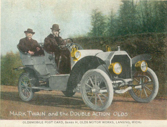 Postcard showing Twain as passenger in a Oldsmobile - Lansing, MI