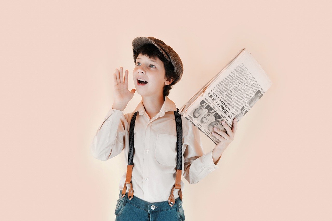 Boy shouting newspaper