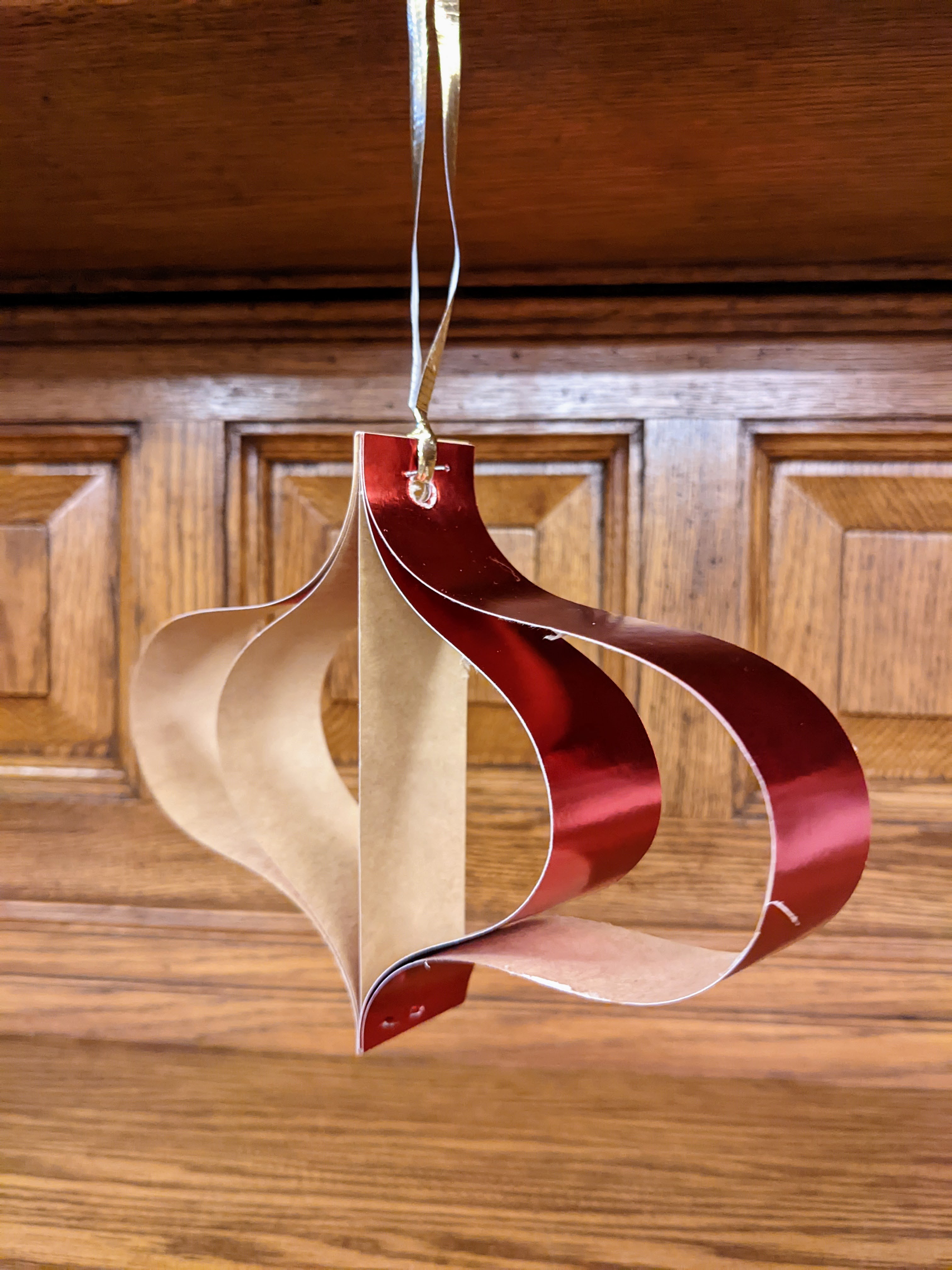 3%20dimensional%20paper%20ornament%20hanging%20on%20the%20fireplace%20mantle.