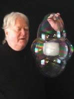 The Bubbleman holds up one of his bubble creations