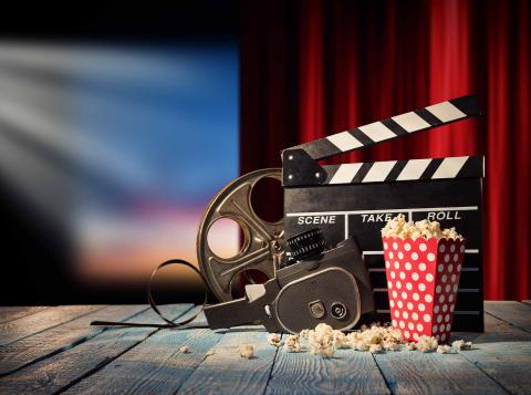 Photo of movie projector and screen.