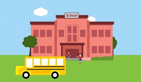 school bus in front of school 