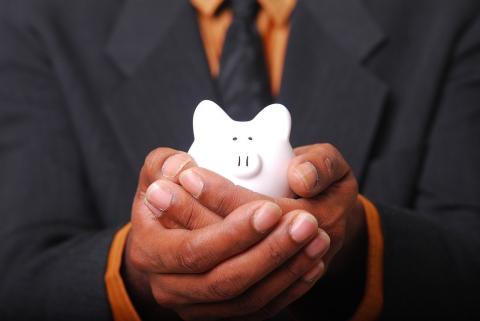 man holding piggy bank
