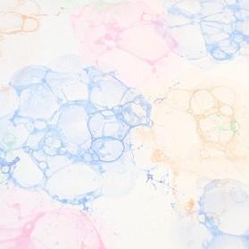 Brightly colored bubbles on  white paper