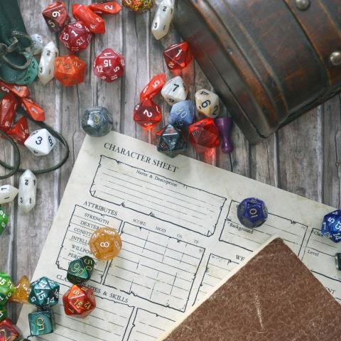 a character sheet for D&D with polyhedral dice