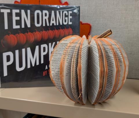 decorative pumpkin made from a book