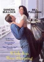 Movie poster of "While You Were Sleeping", featuring Sandra Bullock and Bill Pullman in an embrace