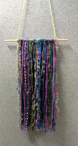Yarn Tapestry made with wooden dowel and scrap pieces of yarn