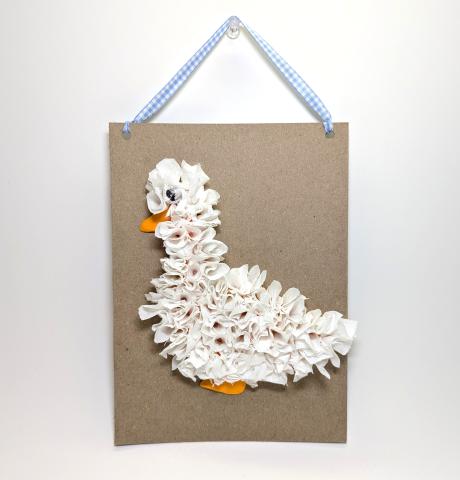 Goose wall hanging craft using tissue and orange dry clay and gingham ribbon