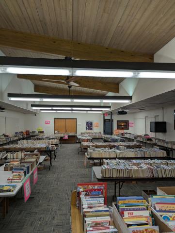 photo of books arranged on tables in the Butman-Fish Library meeting room