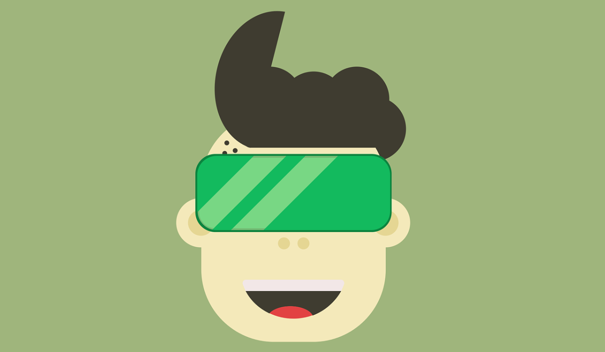 Tween with virtual reality goggles on his face.