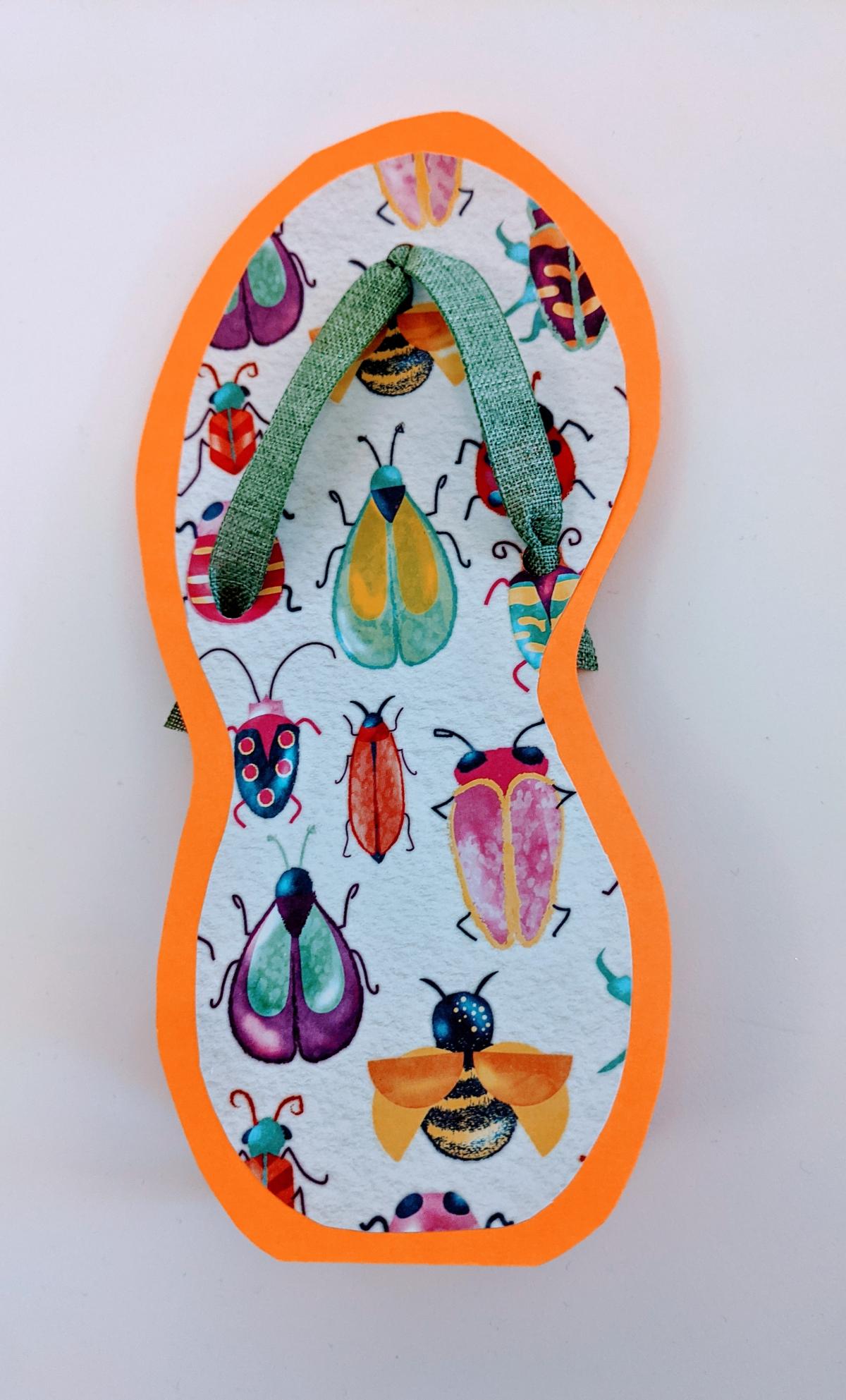 Brightly colored flip flop shaped greeting card made with paper, cardstock, and ribbon.