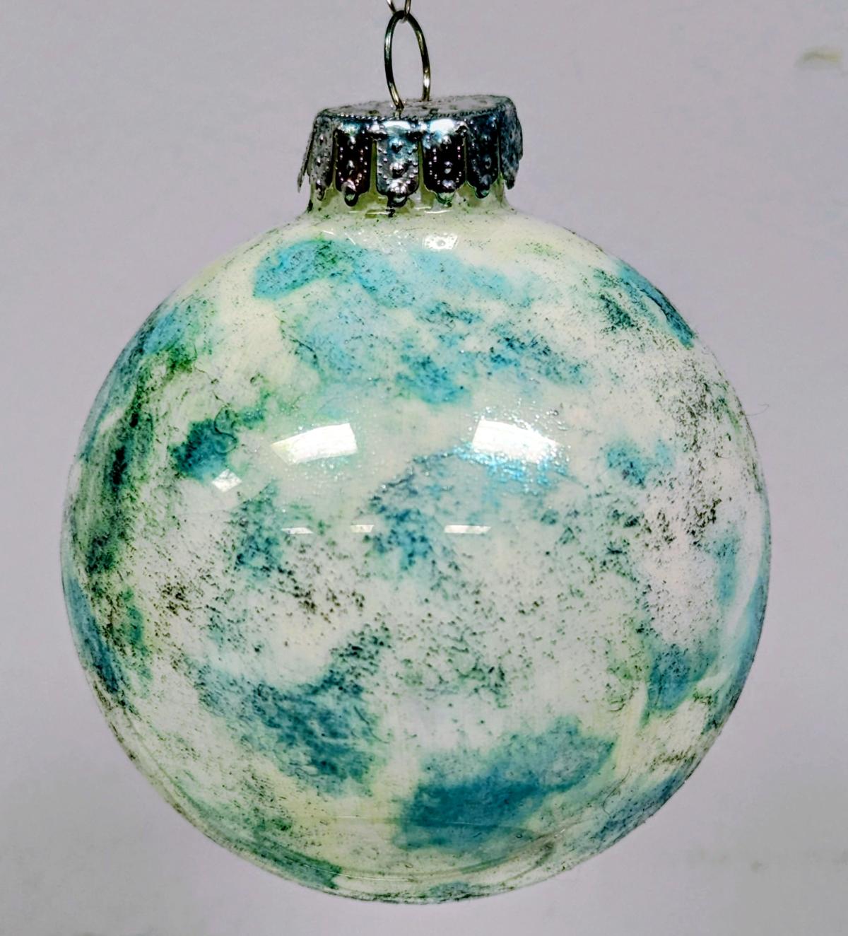 Marbled Christmas Ornament in white, blue, green, and silver.