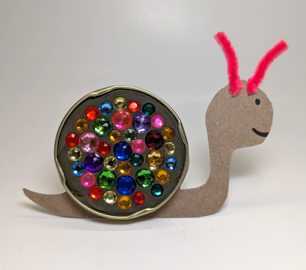 Snail craft made with rhinestones, cardboard and pipe cleaners